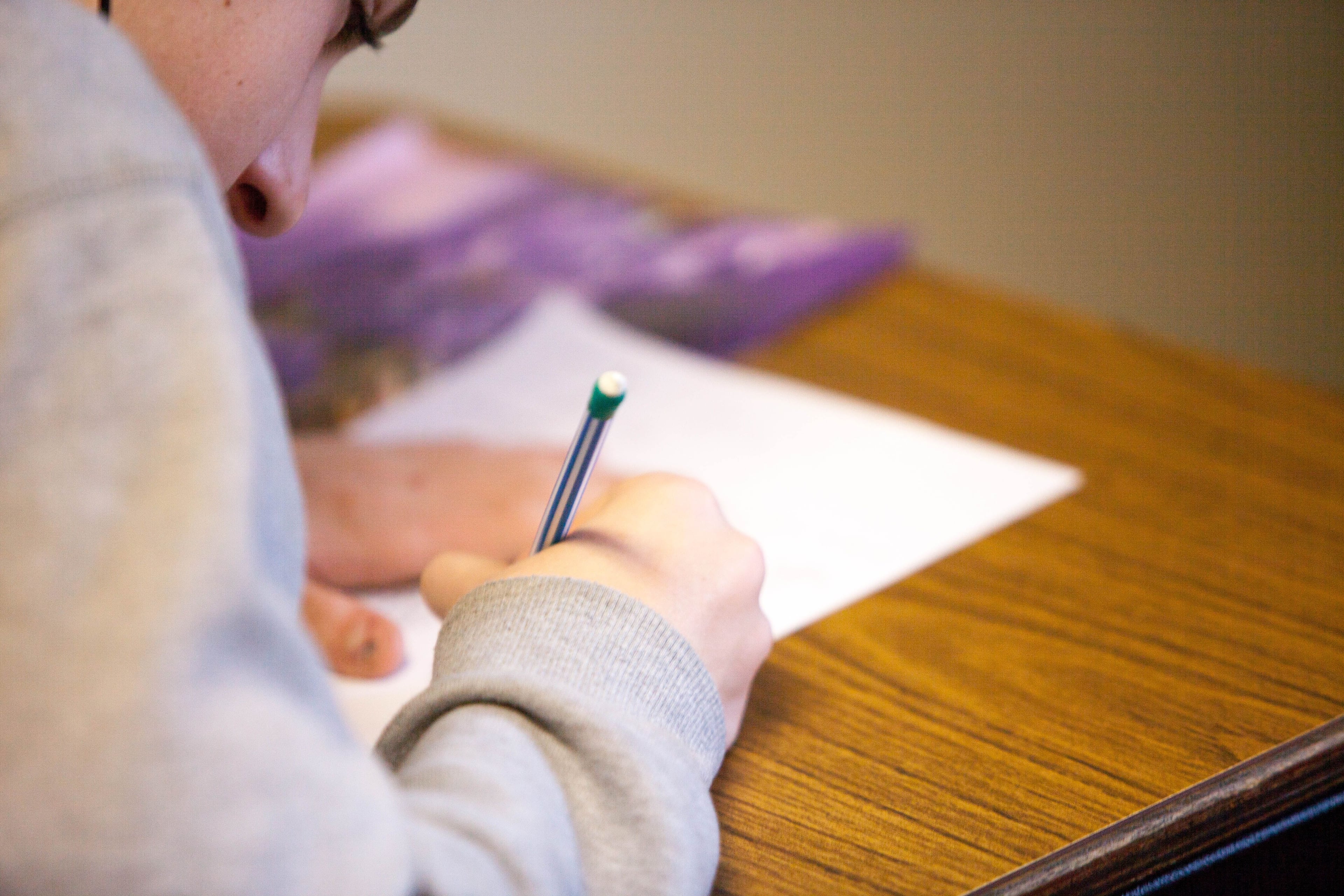 young boy sitting for an exam