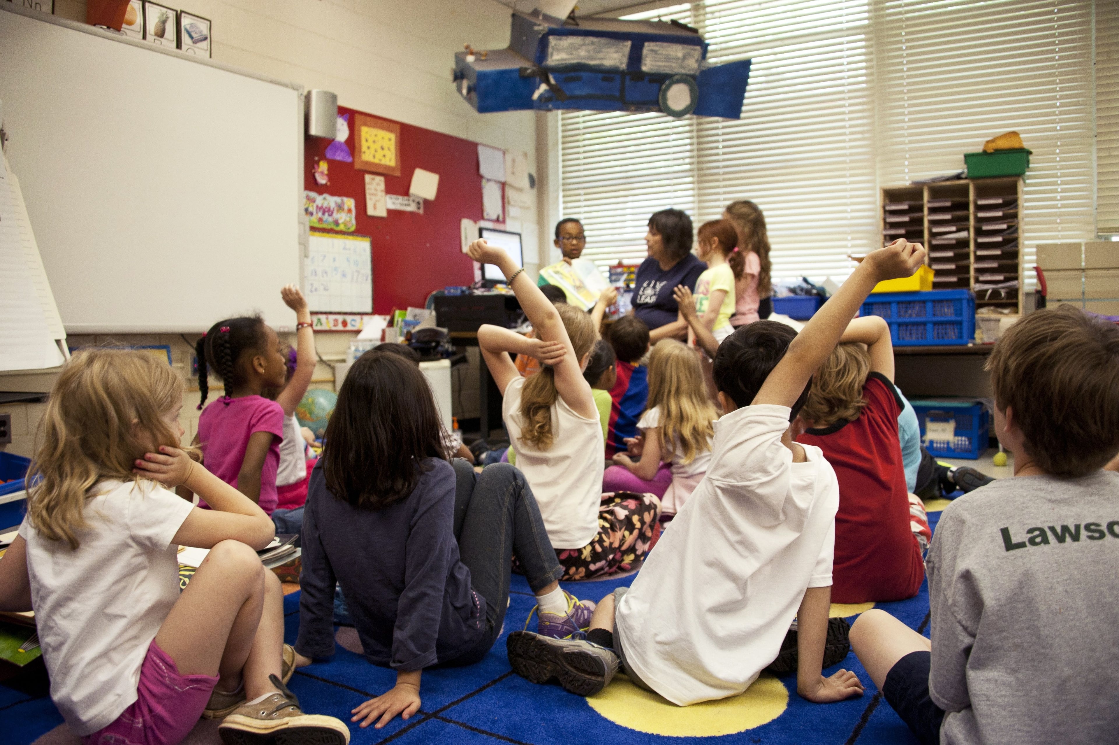 teacher actively working with her students