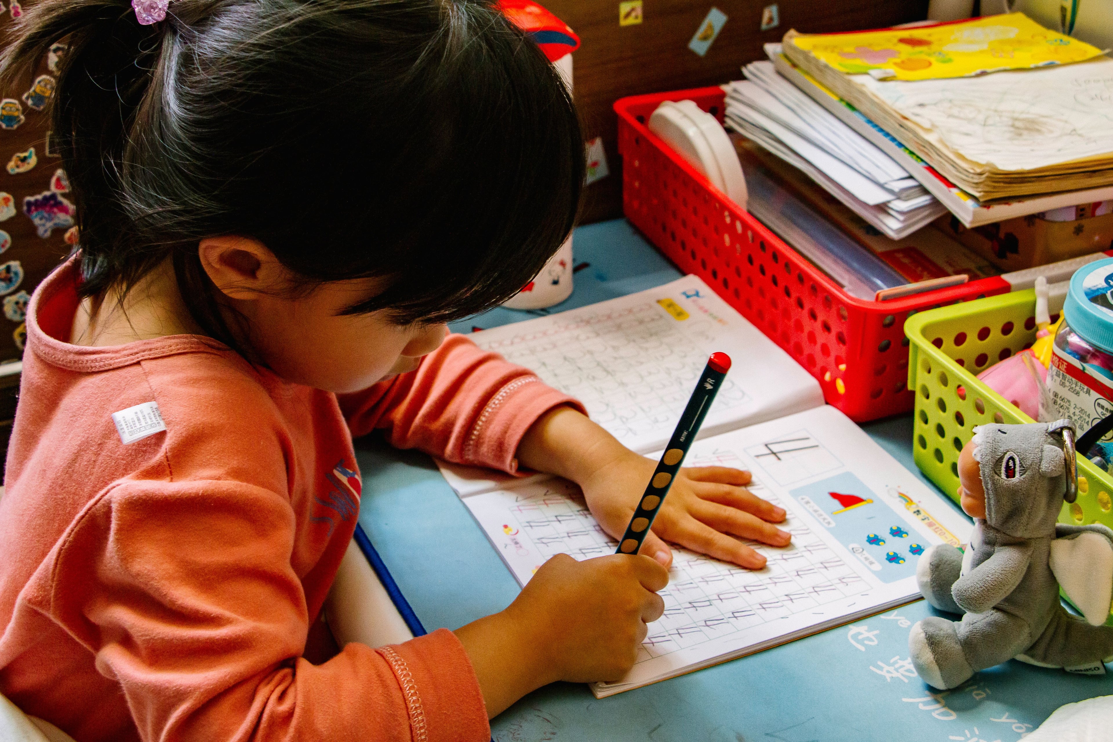 young girl working in her workbook