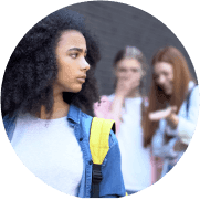 Confused black schoolgirl front mocking college teenagers, laughing classmates