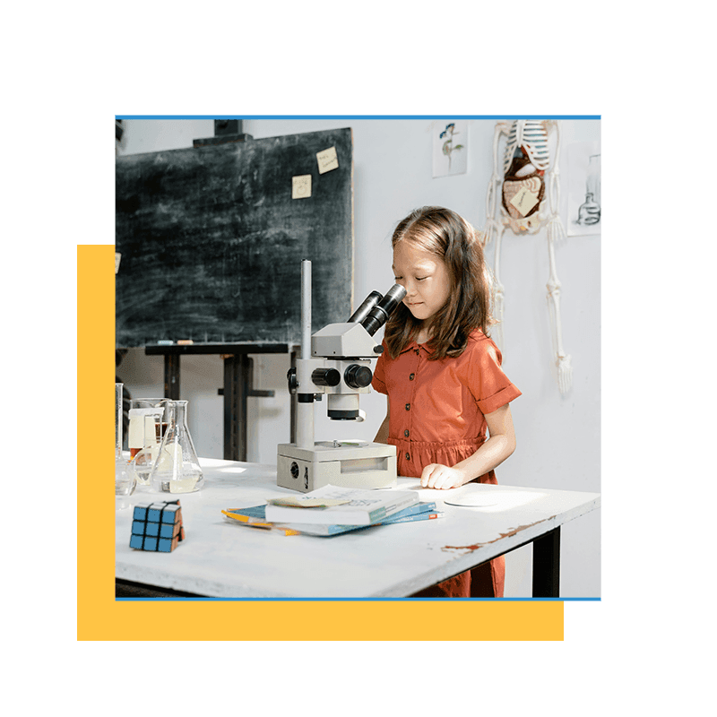 girl using a microscope