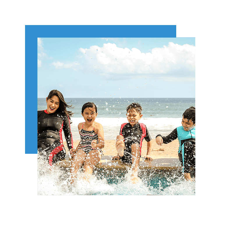 kids enjoying summer splashing water by the beach